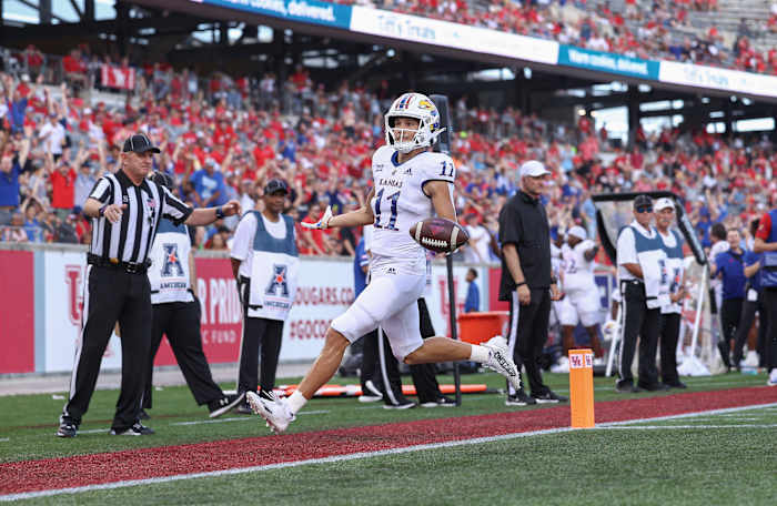 Sep 17, 2022; Houston, Texas, USA; Kansas Jayhawks wide receiver Luke Grimm (11) reacts after scoring a touchdown during the second quarter against the Houston Cougars at TDECU Stadium